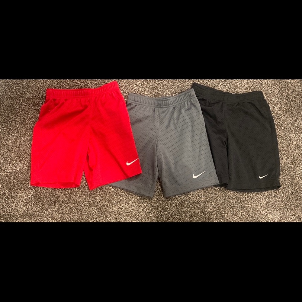 (3) pairs of Nike athletic shorts. Size 7